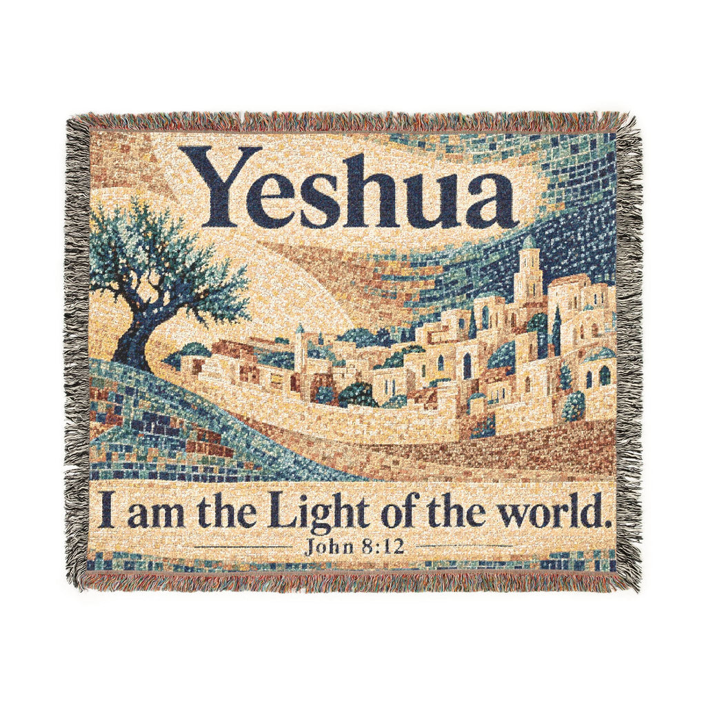 A square woven tapestry with fringe edges, featuring a mosaic-style depiction of a hillside town under a pale sky, with the word 'Yeshua' at the top and the phrase 'I am the Light of the world. John 8:12' at the bottom.
