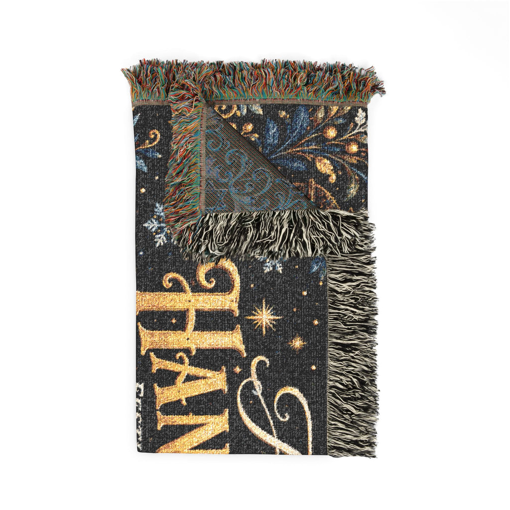 A woven throw blanket with fringe, featuring a dark navy and black background with gold glitter-style lettering, stars, and a blue patterned corner panel.