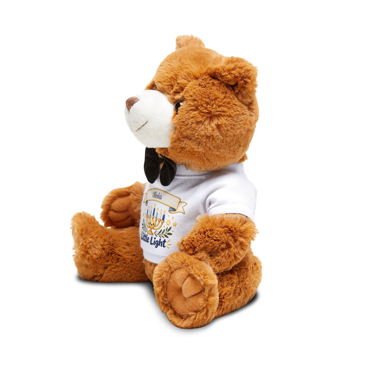 Brown teddy bear wearing a white shirt with a design on a white background