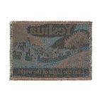 A square woven throw blanket featuring the band Yes and their album 'Seven Ones' artwork. The blanket has a textured, pixelated design in shades of blue, brown, and gray, with fringed edges on all four sides.