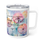 A white insulated travel mug with a clear lid and handle, featuring a colorful watercolor dandelion design and the Bible verse Philippians 4:13 printed on the front.