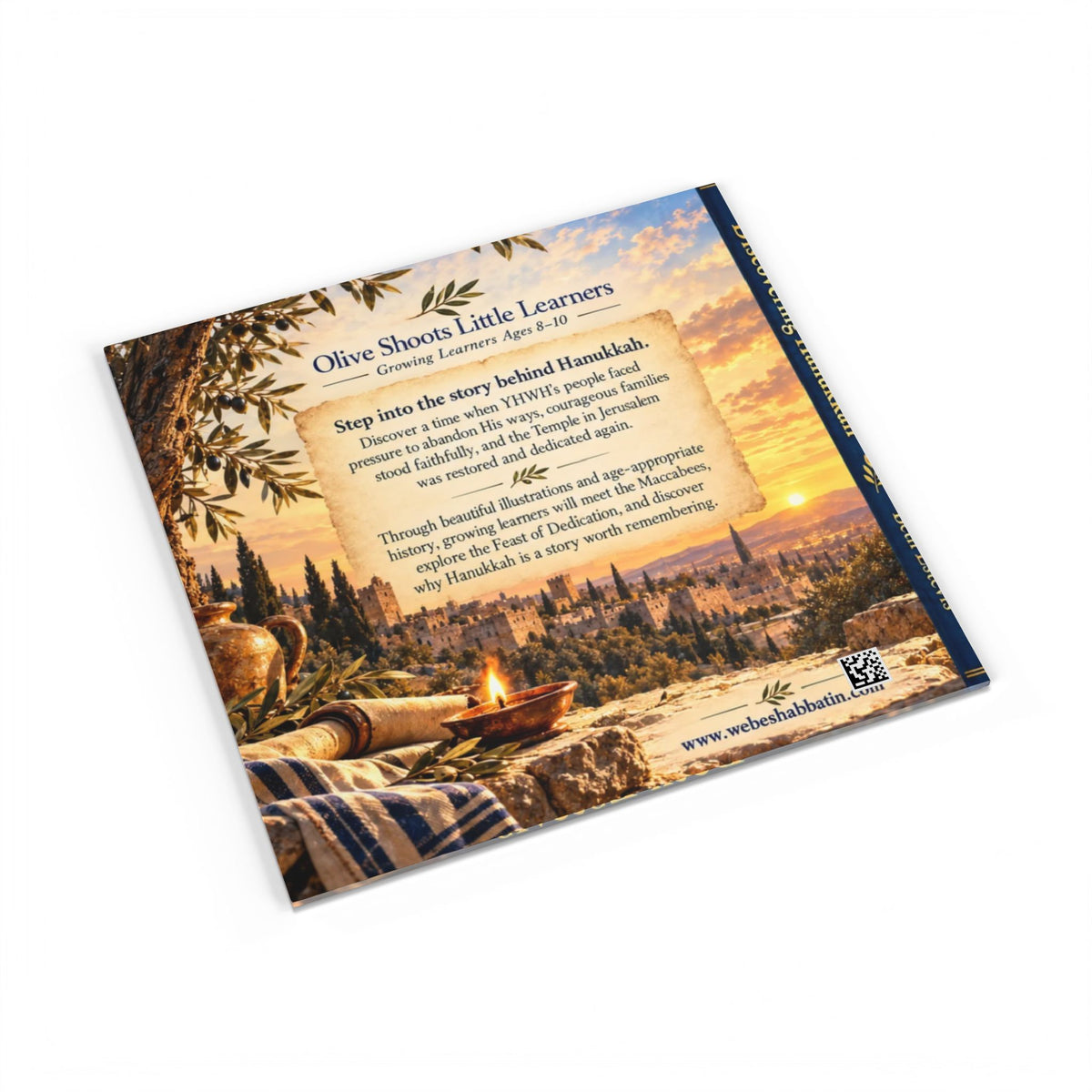 A single printed booklet or book cover shown at an angle on a plain white background. The cover features a scenic outdoor landscape with a campfire, trees, and a sunset sky, plus readable text including the title 'Olive Shaws Little Learners' and a website at the bottom.