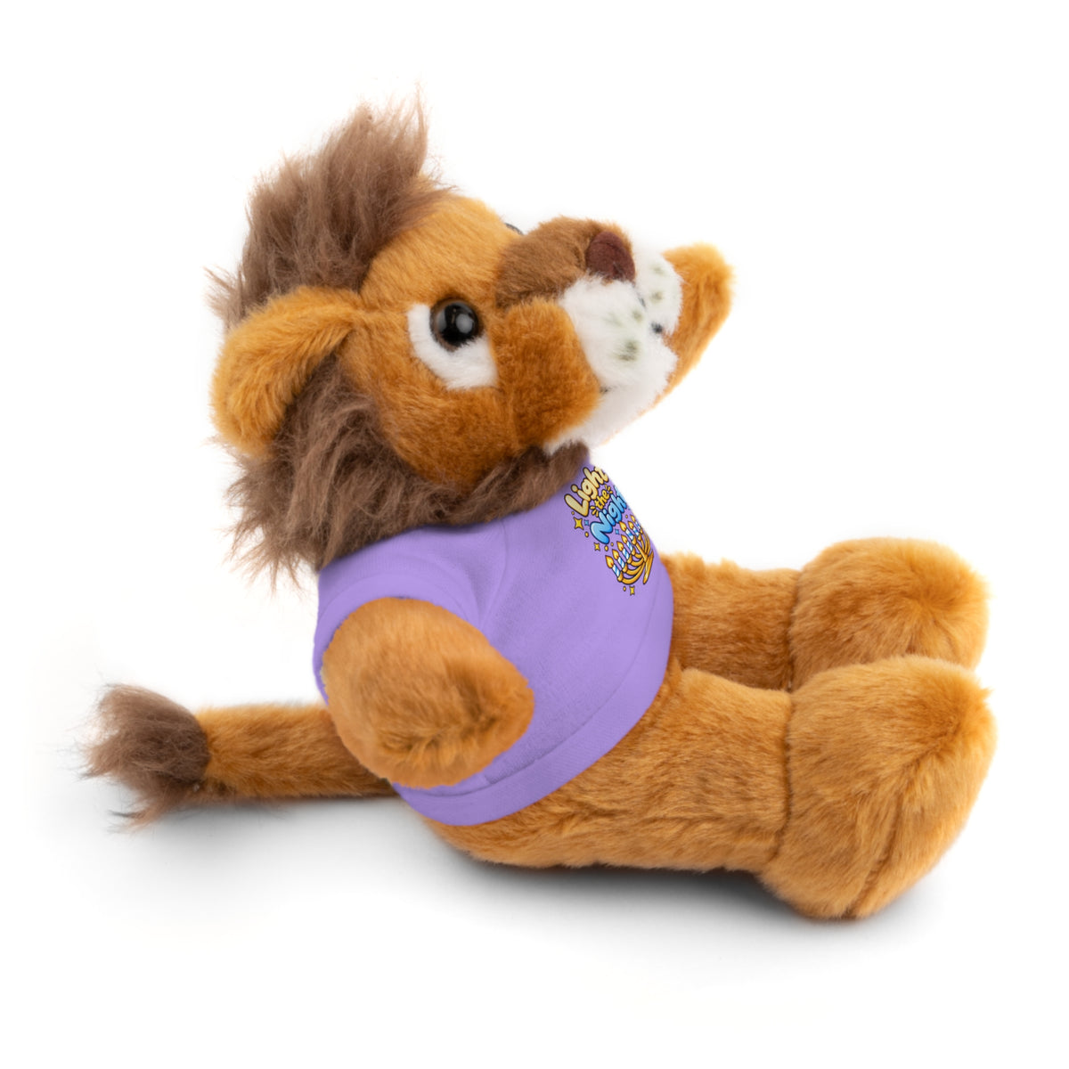 Plush toy lion wearing a purple shirt on a white background