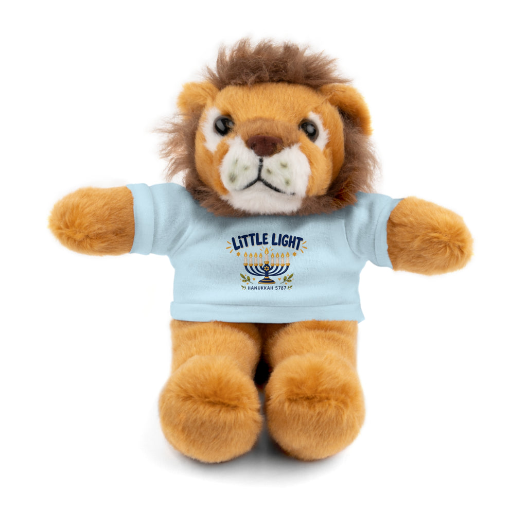 Plush lion toy wearing a light blue t-shirt with a logo on a white background