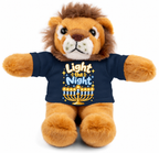 A plush lion toy with a navy blue shirt printed with the phrase 'Light the Night' and a menorah graphic, photographed against a plain white background.