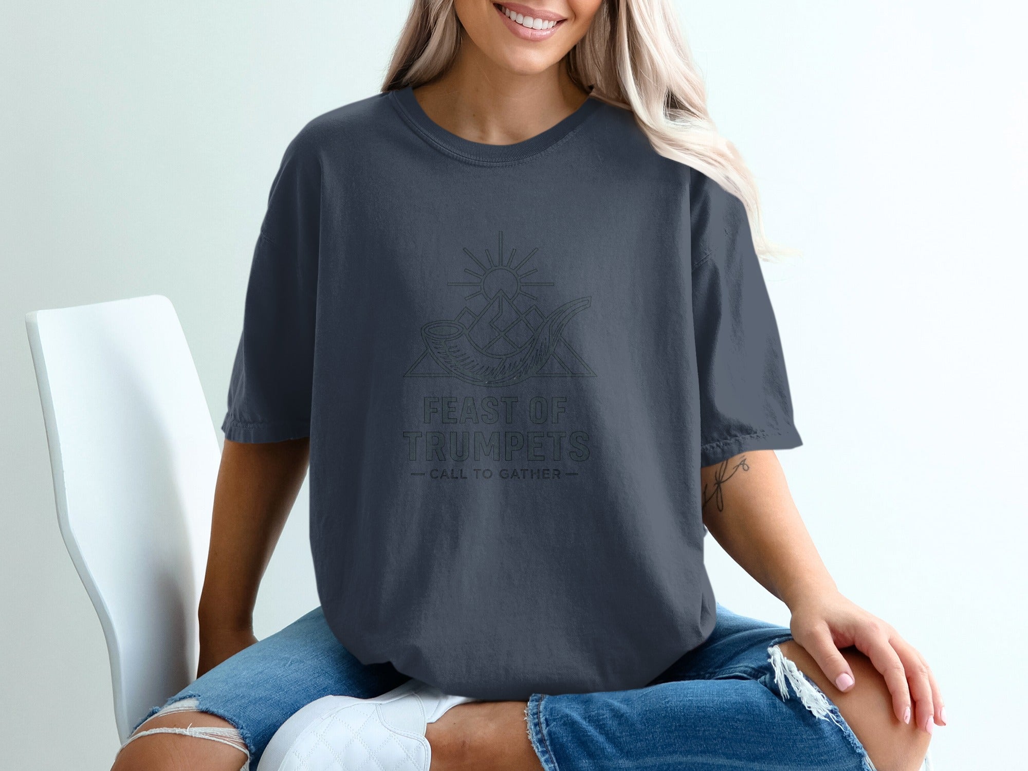 Dark grey t-shirt with "Feast of Trumpets - Call to Gather" text and graphic.