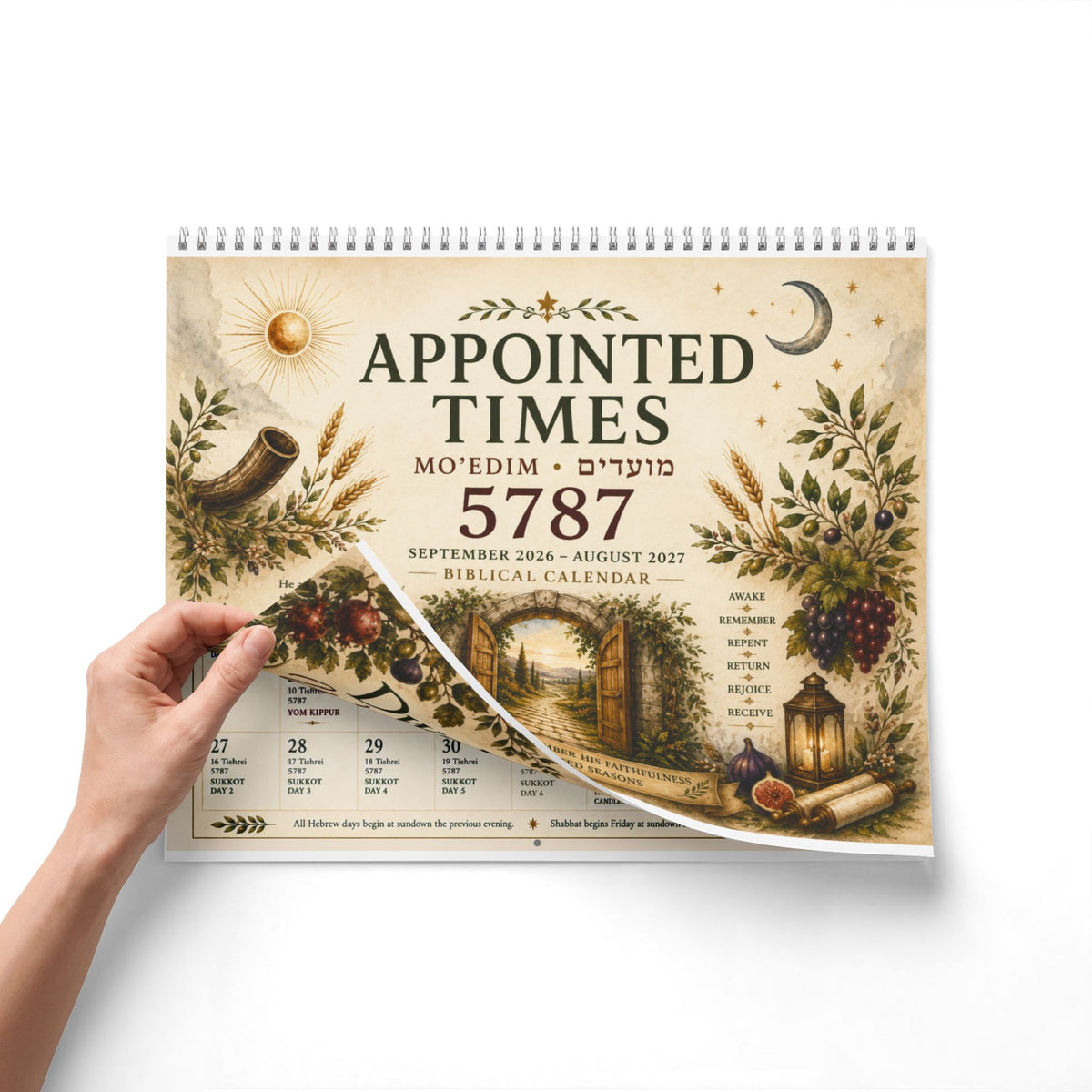 Hand lifting the Appointed Times 5787 calendar cover to reveal the monthly pages
