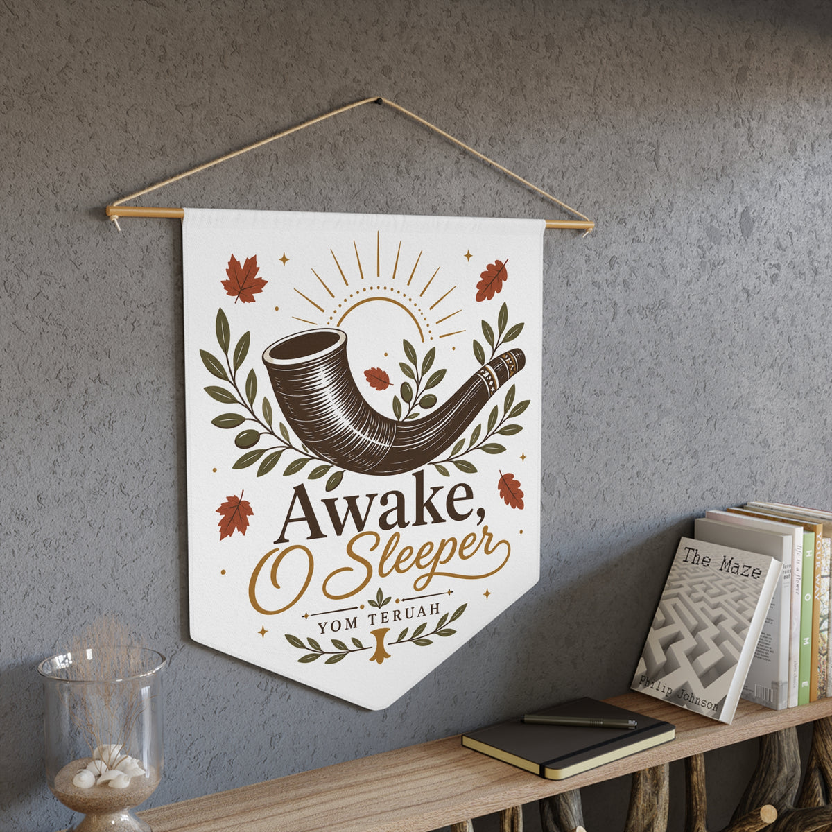 Awake, O Sleeper wall pennant with a dark shofar, sunrays, autumn leaves and Yom Teruah, above a bookshelf