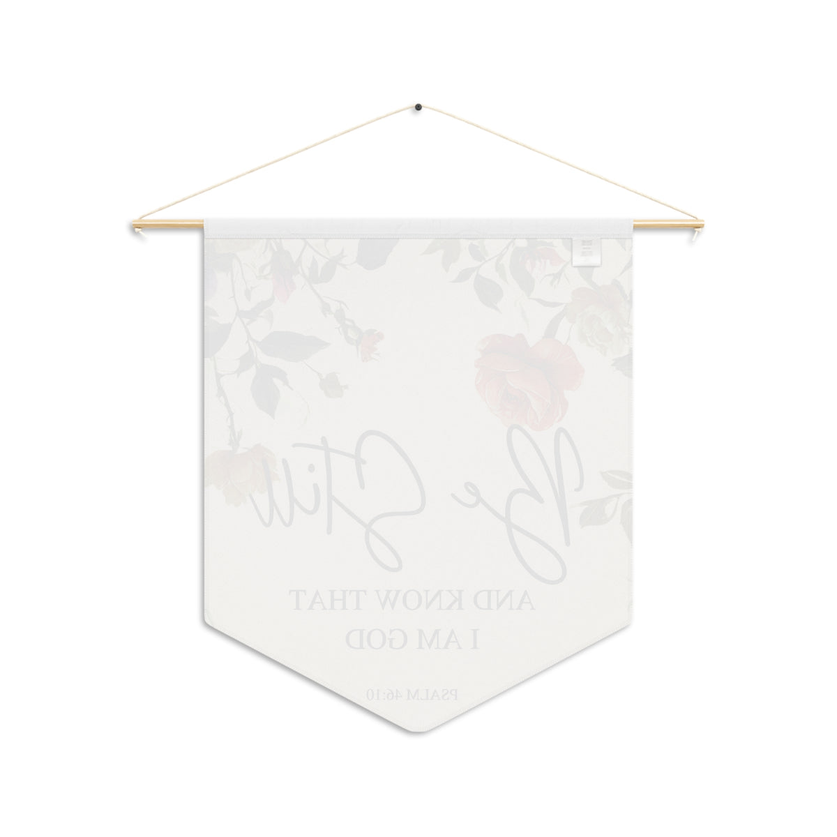 Back of the Be Still wall pennant, with the print showing faintly through the white fabric
