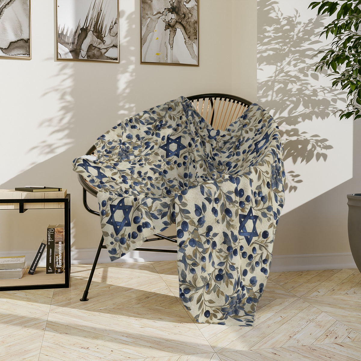 Blue Star of David botanical blanket draped over a round chair, showing large blue Stars of David