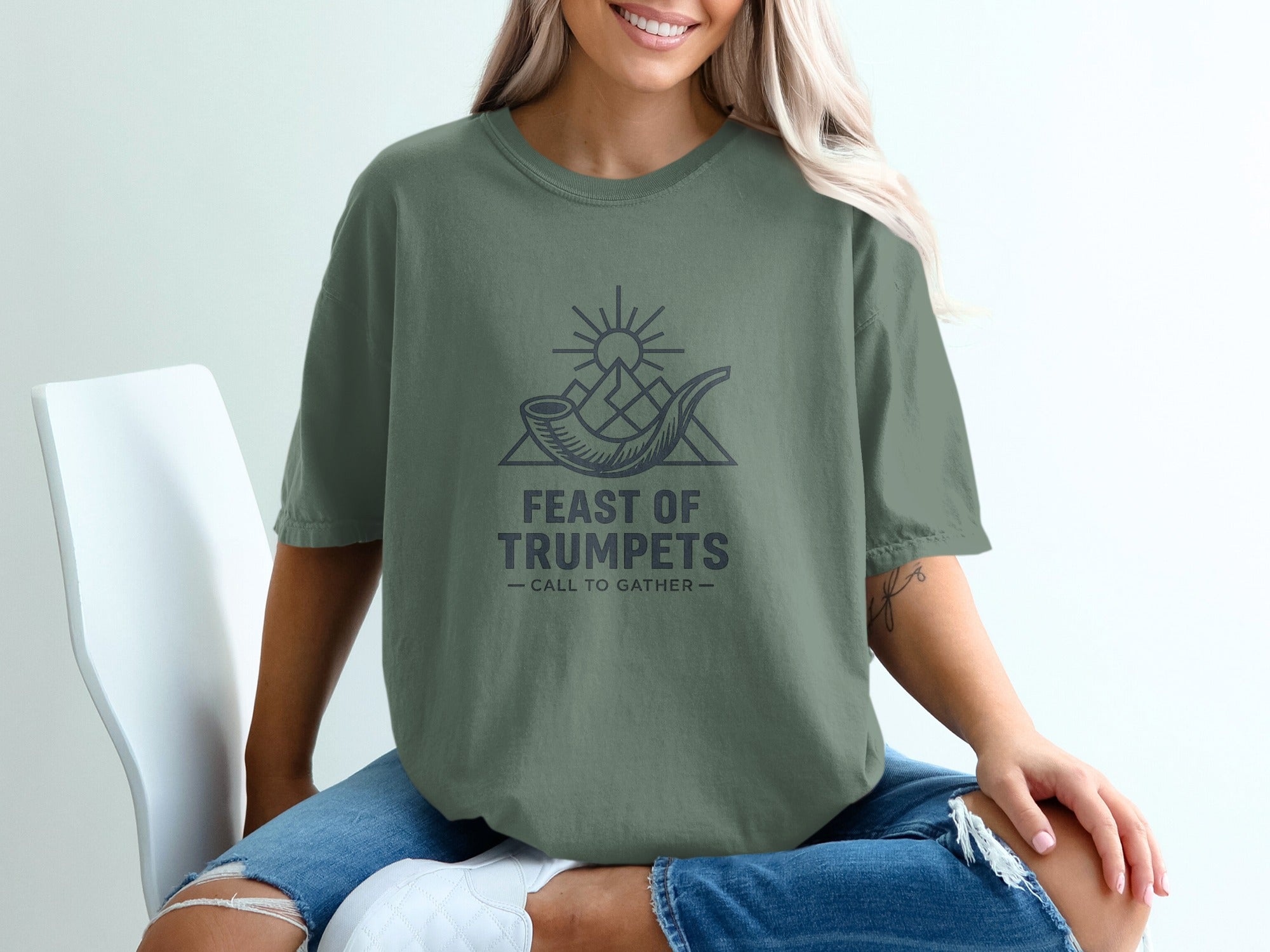 Green t-shirt with "FEAST OF TRUMPETS - CALL TO GATHER" text and shofar graphic.