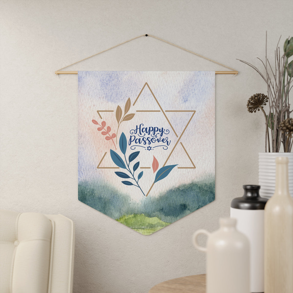 Happy Passover watercolor wall pennant with a gold Star of David and leafy branches, hanging in a living room