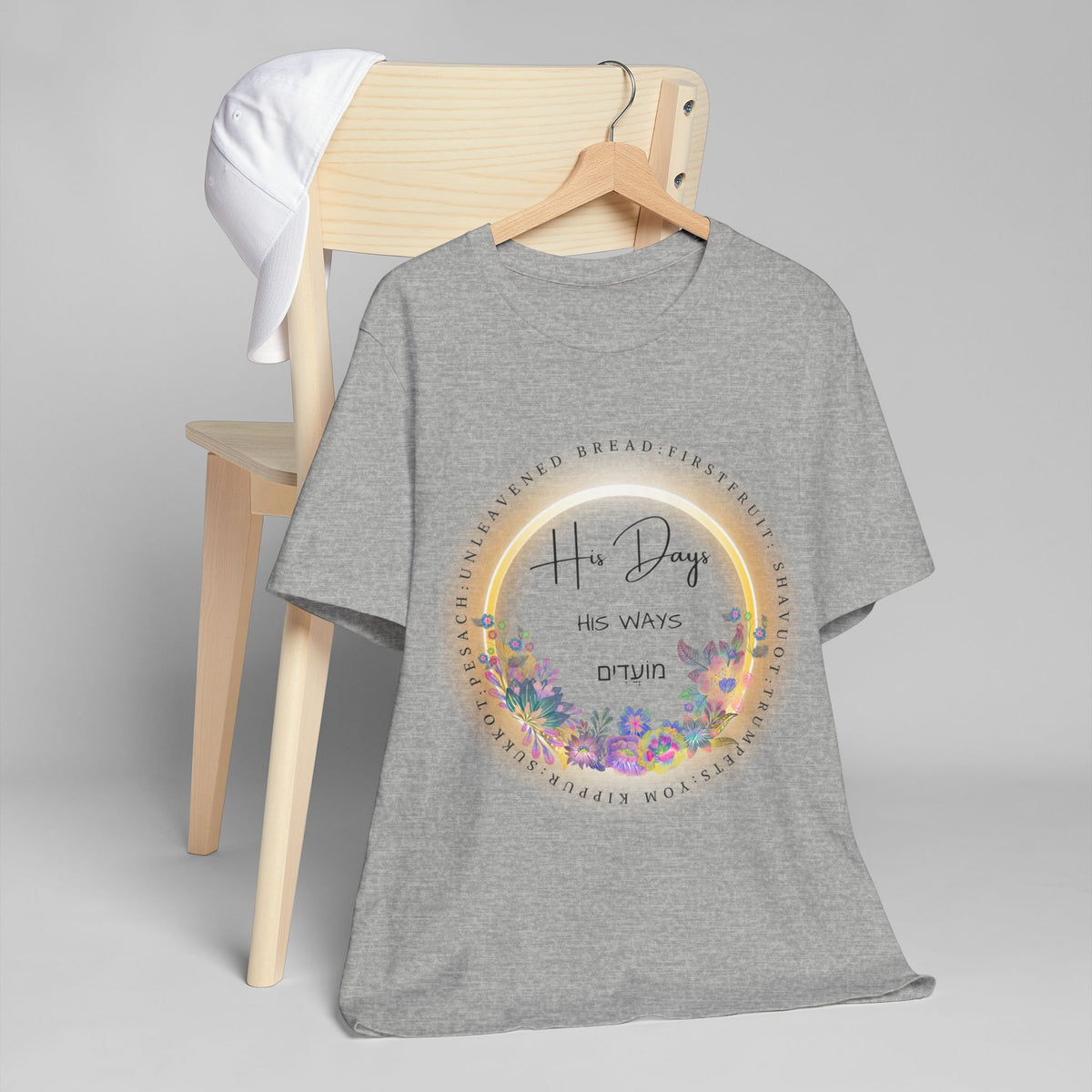 Athletic heather His Days His Ways tee on a hanger draped over a wooden chair