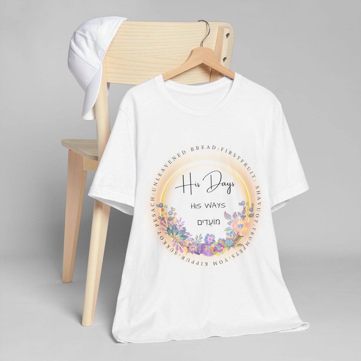 White His Days His Ways tee on a hanger draped over a wooden chair