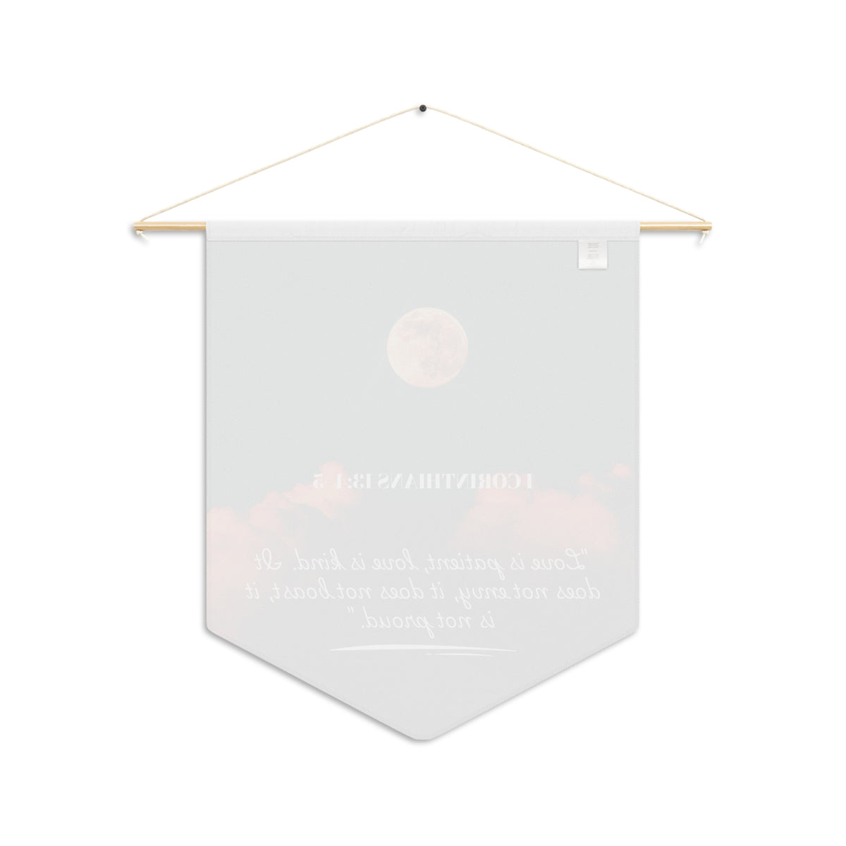 Back of the Love Is Patient wall pennant, with the print showing faintly through the white fabric