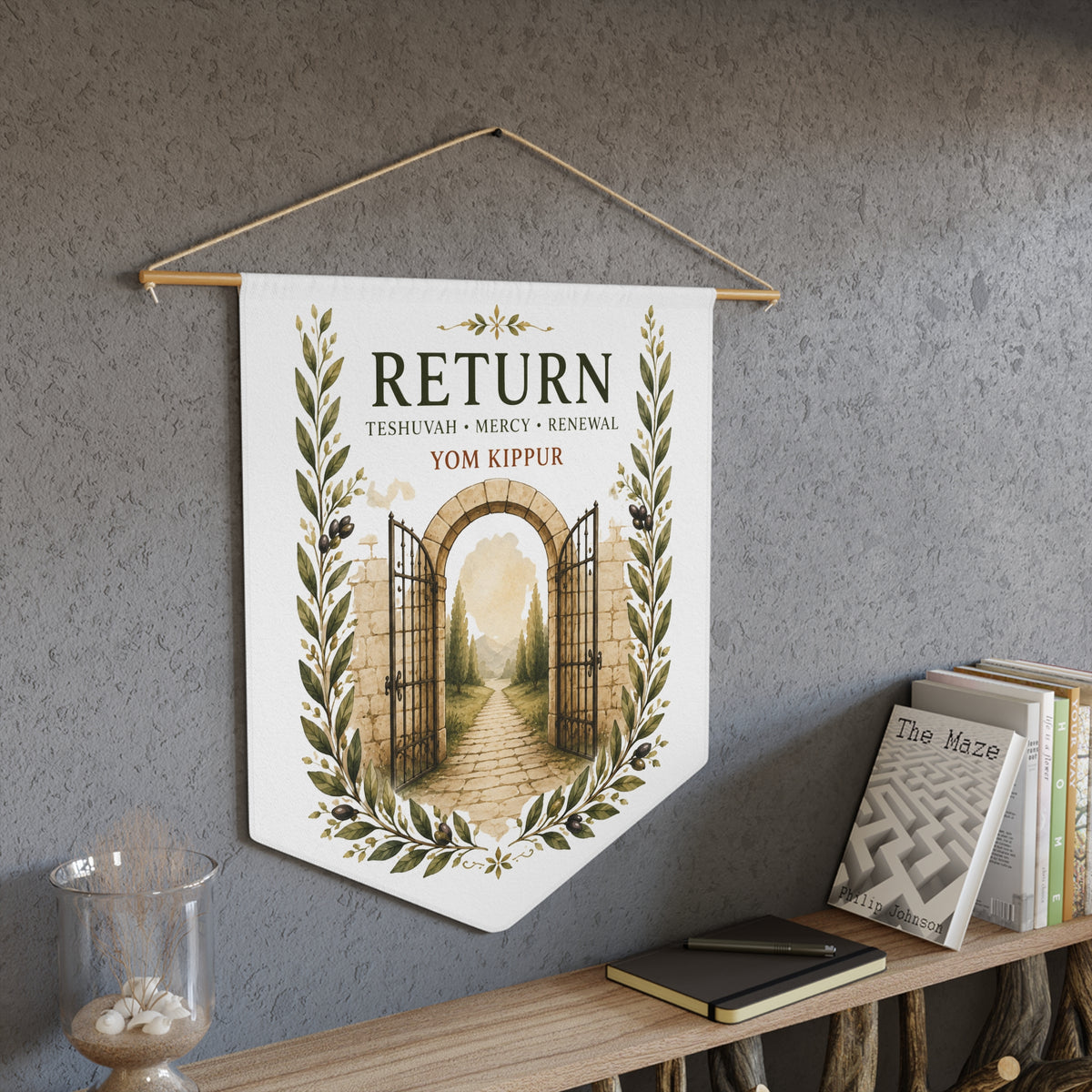 Return wall pennant with an open stone gate and path, "Teshuvah, Mercy, Renewal" and Yom Kippur, above a bookshelf