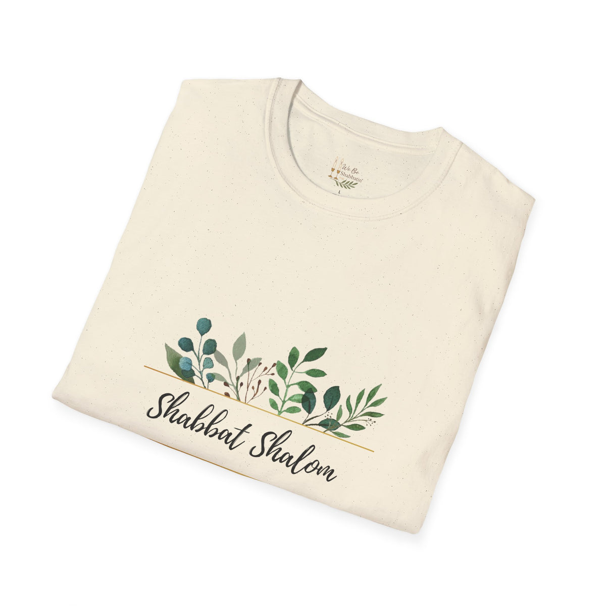 Folded natural Shabbat Shalom t-shirt showing the script lettering and green leaves