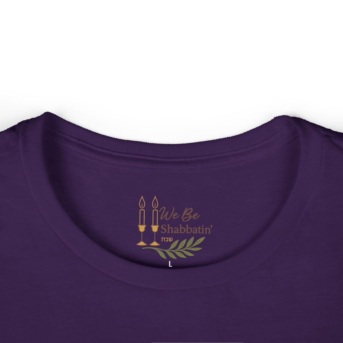 Close-up of the We Be Shabbatin' neck label inside a purple t-shirt