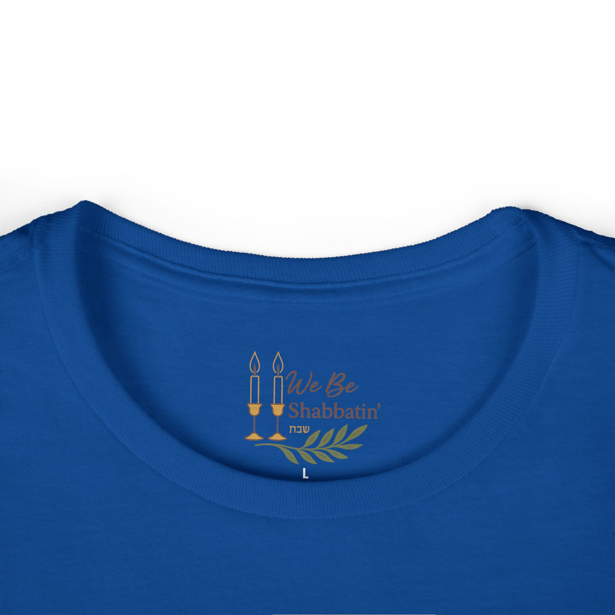 Close-up of the We Be Shabbatin' neck label inside a royal blue t-shirt