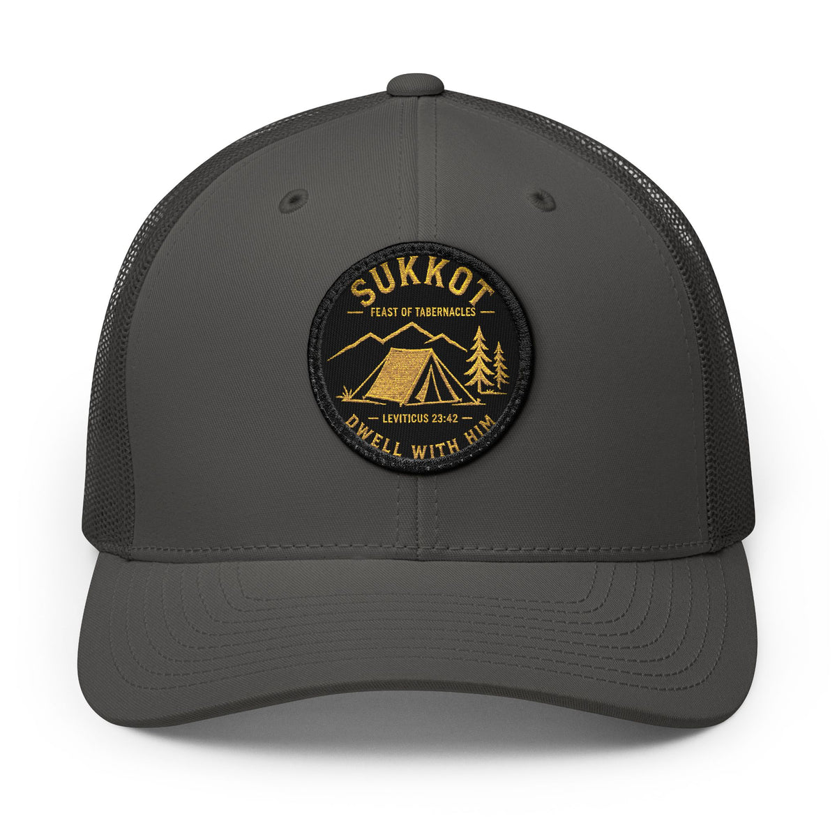 Charcoal trucker cap with a round Sukkot Dwell With Him patch with a gold tent, mountains and Leviticus 23:42, front view