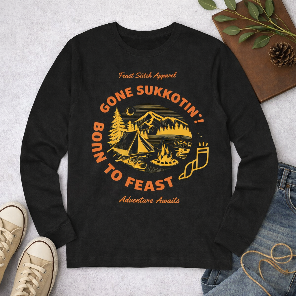 Black Gone Sukkotin' Born to Feast long sleeve shirt with an orange camping and shofar design, laid flat with jeans