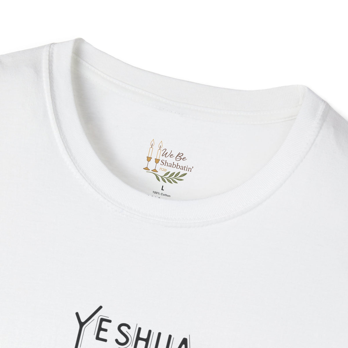 Close-up of the We Be Shabbatin' neck label and Yeshua lettering on a white t-shirt