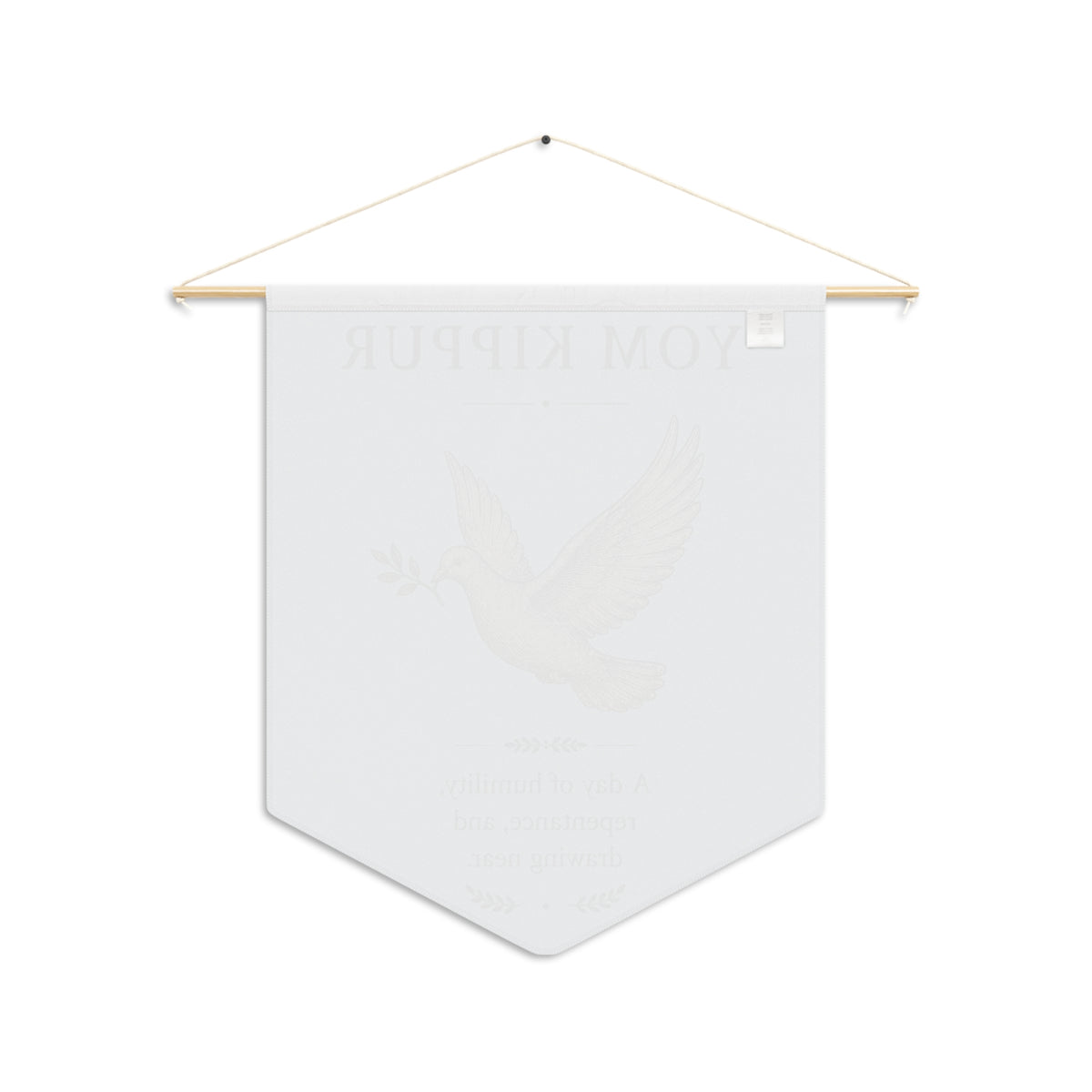Back of the white Yom Kippur wall pennant on a wooden dowel, with the dove design faintly showing through