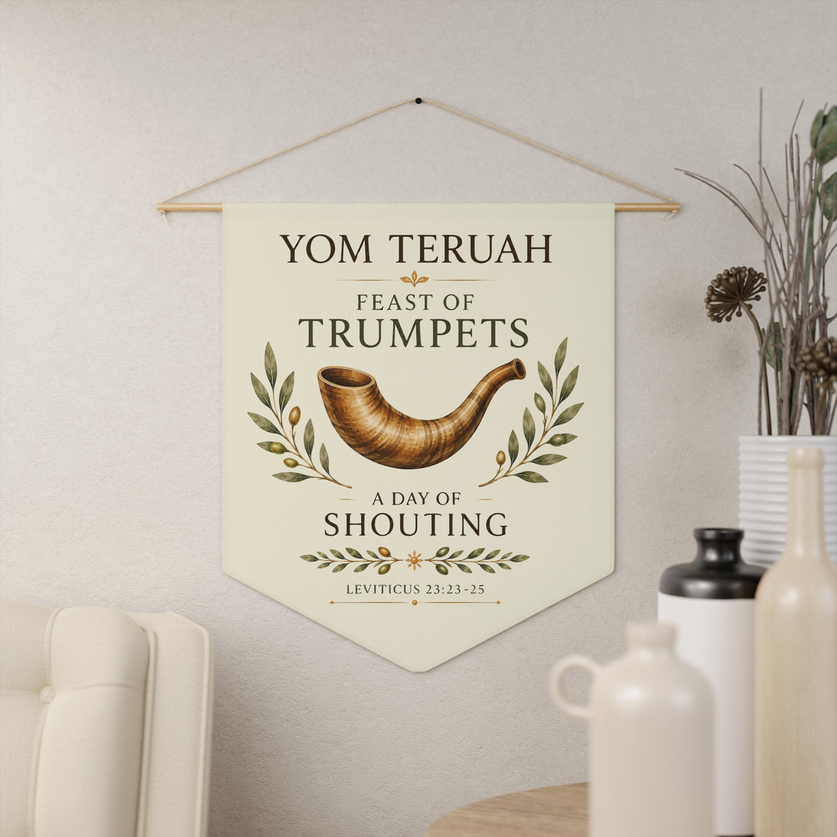 Cream Yom Teruah wall pennant with a shofar in olive branches, "Feast of Trumpets, a day of shouting" and Leviticus 23:23-25, in a living room