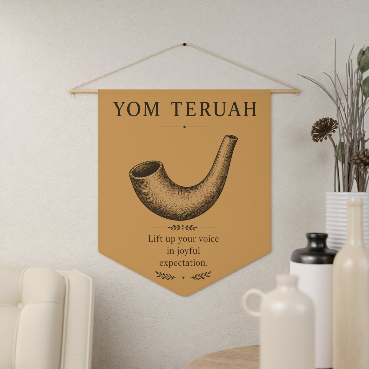 Tan Yom Teruah wall pennant with a shofar sketch and "Lift up your voice in joyful expectation.", in a living room